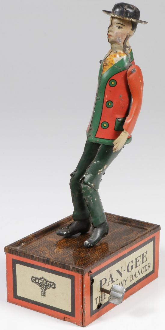 A CARTER TIN WIND-UP PAN-GEE THE FUNNY DANCER: A CARTER TIN WIND-UP PAN-GEE THE FUNNY DANCER. A scarce C.E. Carter and Co. lithographed tin wind-up dancing toy. In working condition. Height 10 inches (25.5 cm). Provenance: From the l