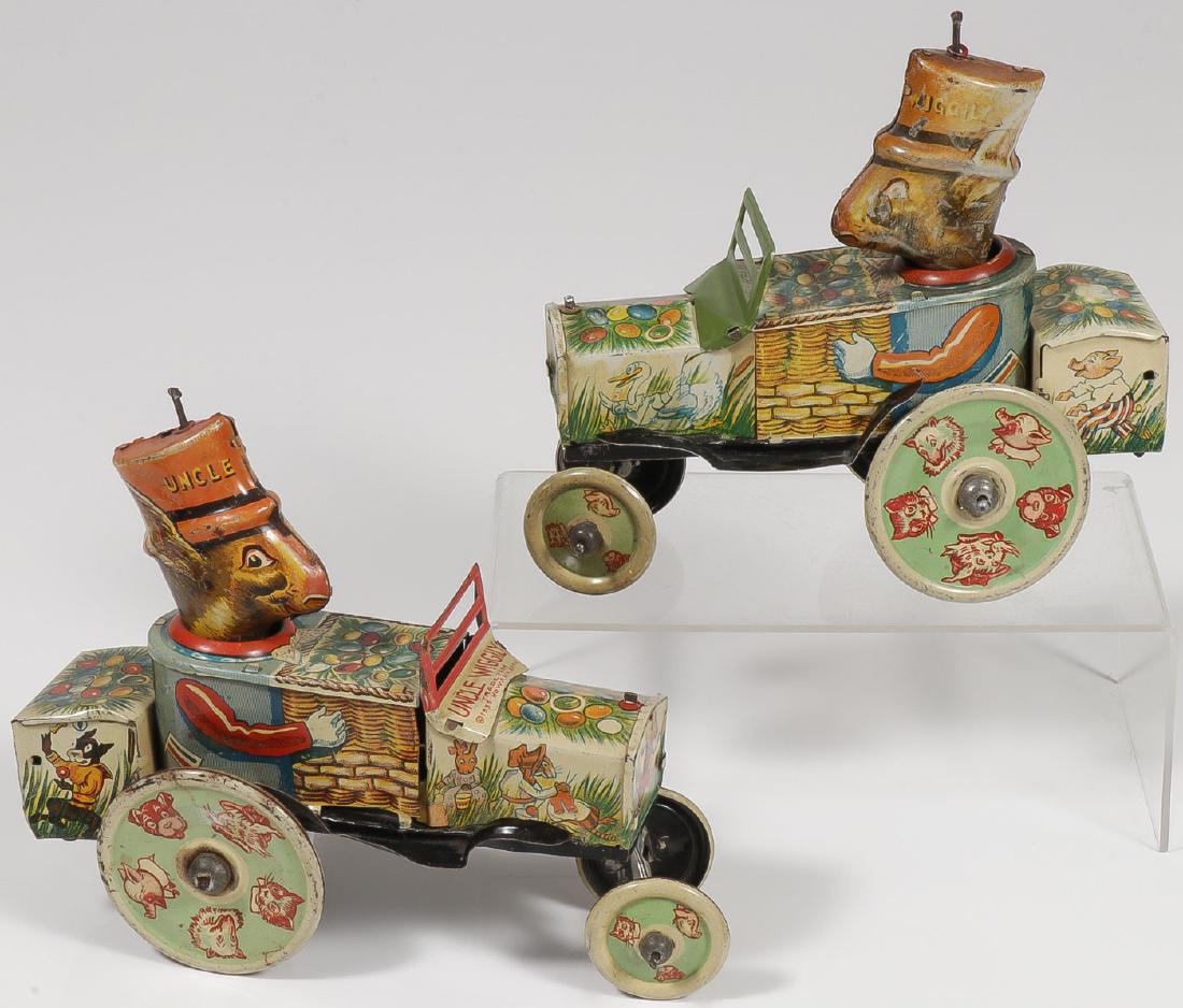 TWO TIN UNCLE WIGGILY WIND UPS: TWO TIN UNCLE WIGGILY WIND UPS. Comprising two Marx Uncle Wiggily crazy cars, one missing a rear wheel, the other does not hold wind but is complete. Both in varying states of condition. Length 7.75 i