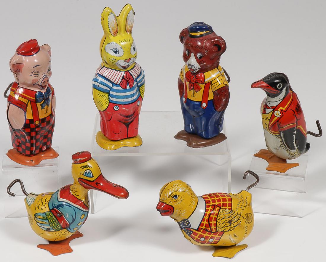 SIX CHEIN WIND-UP WALKERS: SIX CHEIN WIND-UP WALKERS. Comprising a penguin, pig, bunny, bear, chick, and Donald Duck. Each with Chein shield mark and each fully operable. Greatest height 5.1 inches. Provenance: From the l