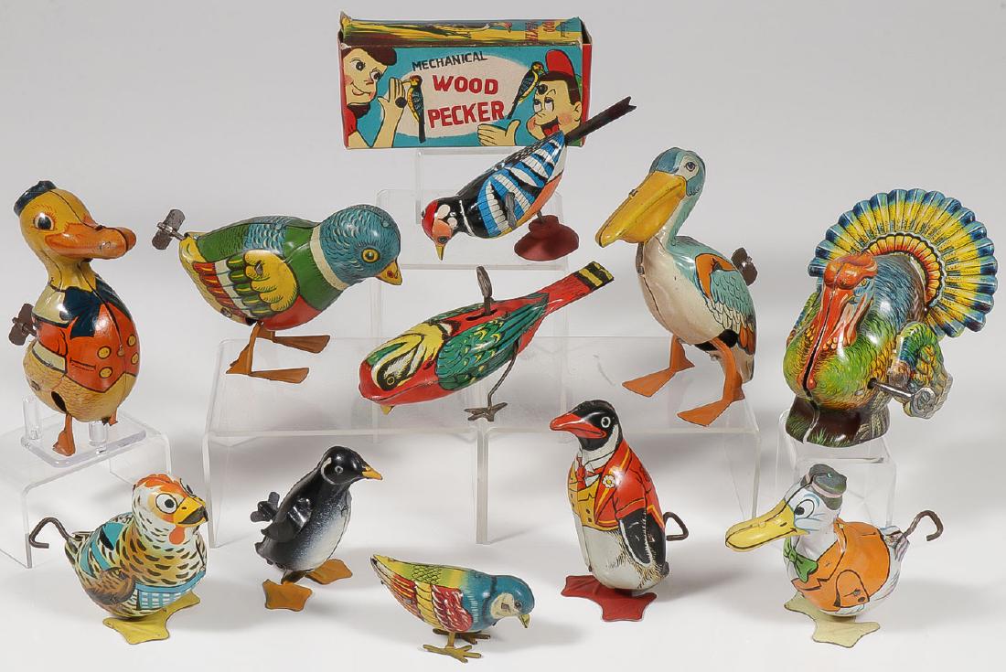 11 TIN WIND-UP BIRDS: 11 TIN WIND-UP BIRDS. Comprising various makers: Lindstrom, Chein, and U.S. Zone Germany. Including a pelican, a penguin, a turkey, a chicken, ducks, a cardinal, and others. All but a few seem to 