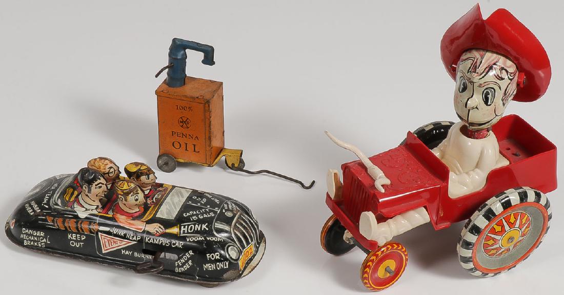 THREE MARX TOYS: THREE MARX TOYS. Comprising a tin litho wind-up "Kampus Car," 6.75 inches, a tin and plastic wind-up "Ride'em Cowboy," and a tin Marx Penna Oil Gas Service Station item. P
