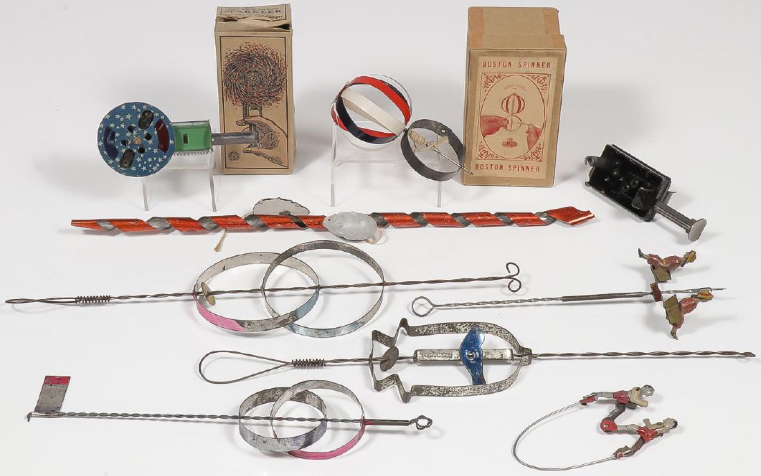 GROUP OF EIGHT TIN TOYS: GROUP OF EIGHT TIN TOYS. Comprising a Lehmann gravity driven painted tin Climbing Mice, a tin gravity roundabout with human figures and flag finial, three gravity spinners, a tin squeeze wire boxing t