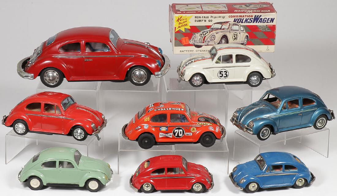 8 VINTAGE METAL VOLKSWAGEN BEETLES: 8 VINTAGE METAL VOLKSWAGEN BEETLES. Comprising a large tin Bandai battery-operated Beetle with visible engine, length 15 inches, a Taiyo battery-operated Bump'N Go Beetle with original box