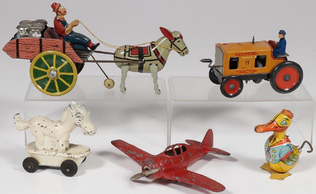 FIVE VINTAGE METAL TOYS: FIVE VINTAGE METAL TOYS. Comprising a Unique Art tin wind-up Hee-Haw cart, works, a Hessmobil tin wind-up tractor, won't hold wind, a National Products sparkplug horse, a Hubley Kiddy&