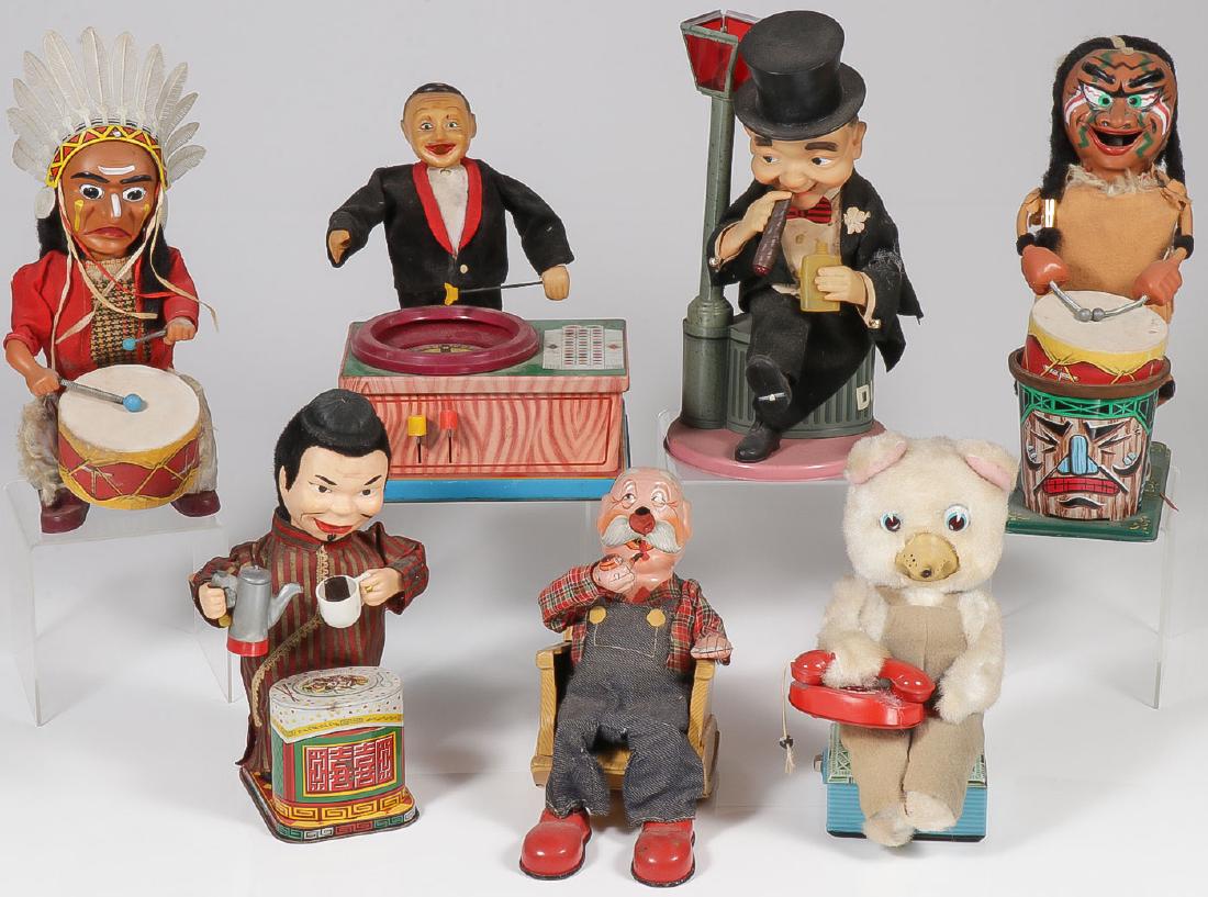 7 VINTAGE BATTERY POWERED TOYS: 7 VINTAGE BATTERY POWERED TOYS. Comprising an Alps drumming Indian Chief, a Plaything Roulette dealer, a cigar smoking drunk, a standing Indian drummer, a Chinese tea-maker, a San Rocking Grandpa,