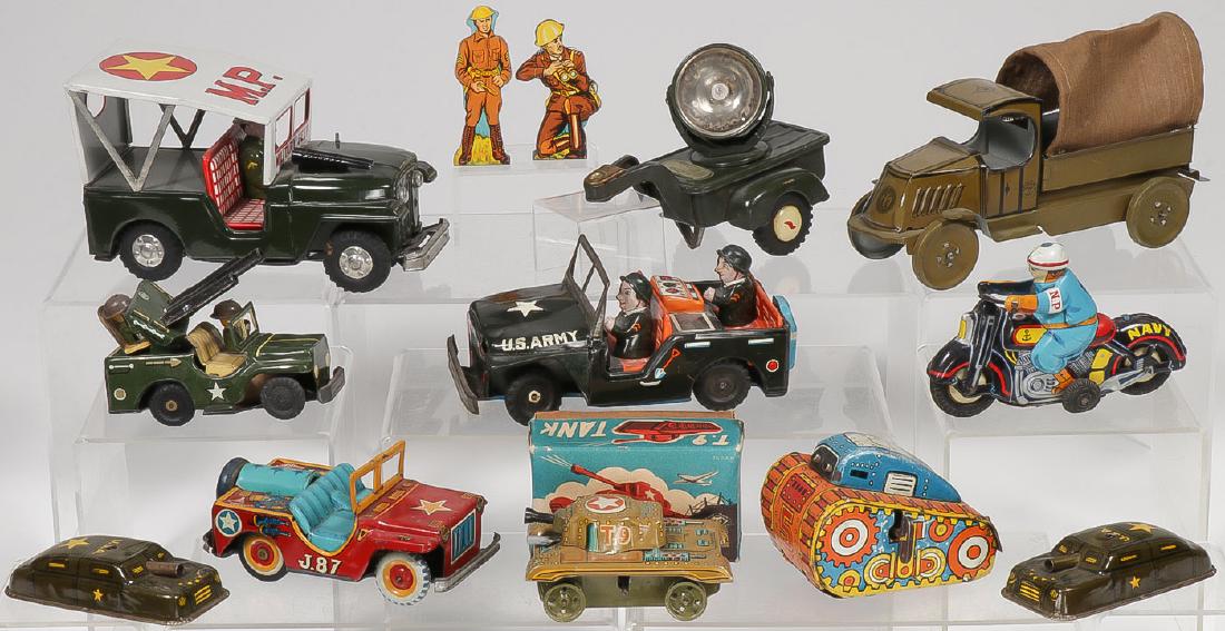13 VINTAGE TIN MILITARY TOYS: 13 VINTAGE TIN MILITARY TOYS. Comprising a good Masudaya T9 key wind tank in original box, runs well missing rubber tracks (length 3.75 inches), a Marx #5 roll over wind-up tank, a Mitsuhashi fri