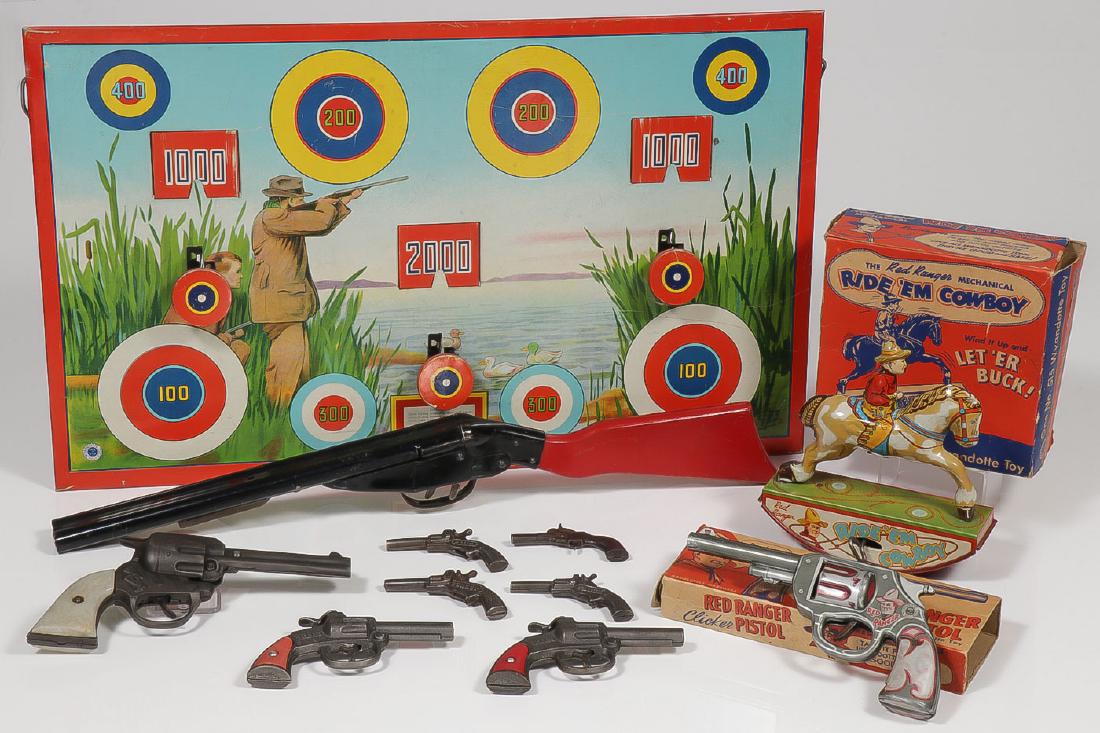GROUP OF CHILDREN'S COWBOY AND MARKSMAN TOYS: GROUP OF CHILDREN'S COWBOY AND MARKSMAN TOYS. Comprising a Wyandotte tin litho pop-up target game with double barreled gun (inoperable), a Wyandotte Red Ranger tin litho Clicker Pistol with o