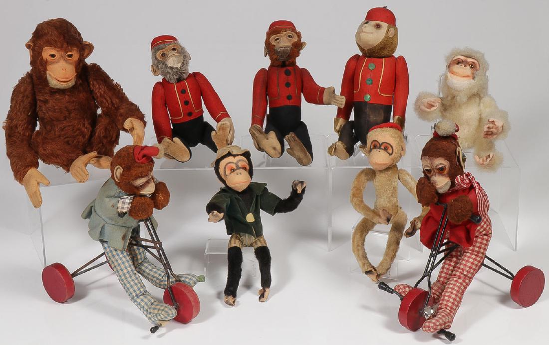 NINE VINTAGE TOY MONKEYS: NINE VINTAGE TOY MONKEYS. Comprising two monkeys on tricycles, three yes/no organ grinder monkeys, and others. Most likely German and perhaps one Steiff. Greatest measurement 13 inches. Provenance: