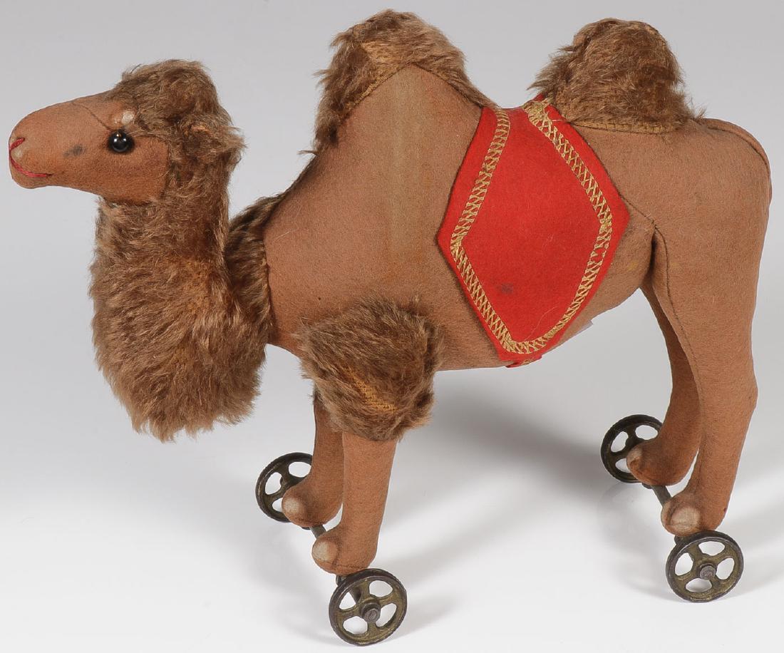 A STEIFF TWO HUMP CAMEL PULL TOY: A STEIFF TWO HUMP CAMEL PULL TOY. Length 11 inches. SHIPPING NOTICE: Jackson's is your sole and only source for one stop packing and shipping. With over 50 years of experience, our profe