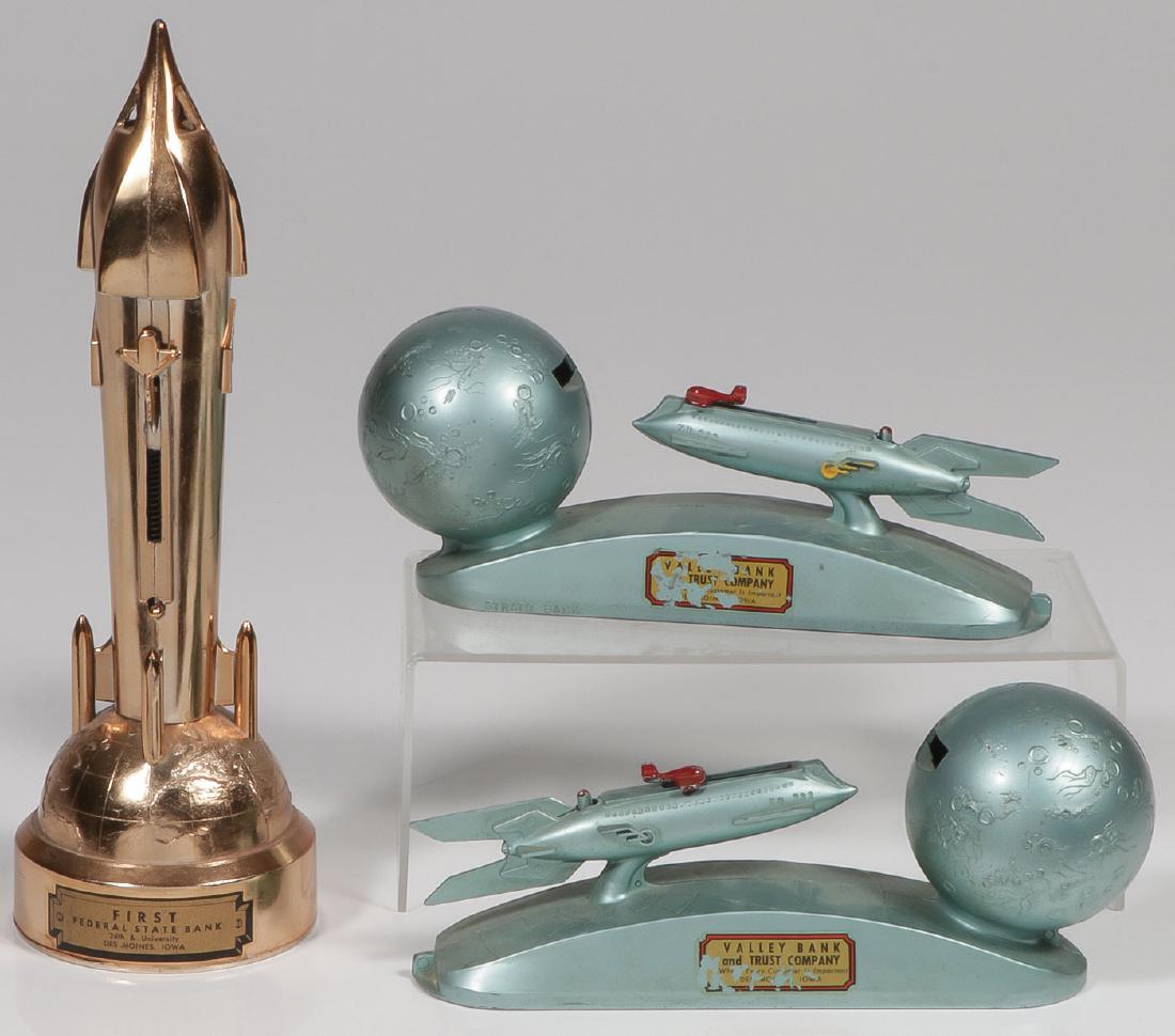 15 VINTAGE BANKS C 1930-1970: 15 VINTAGE BANKS C. 1930-1970. Comprising two mechanical Strato Rocket Banks, each labelled "Valley Bank and Trust Company, Des Moines, IA", a mechanical The Satellite rocket Bank with lab