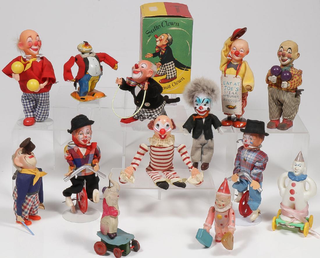13 VINTAGE CLOWN TOYS: 13 VINTAGE CLOWN TOYS. Including a German Salto wind-up Somersault Clown in original box, a Ko-Ko Mechanical Sandwich Man in original box, two wind-up clowns playing maracas, a wind-u