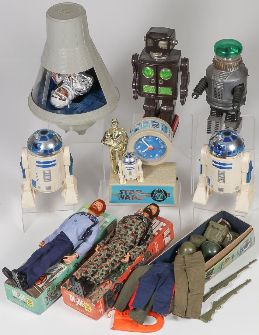 SPACE TOYS AND GI JOES: SPACE TOYS AND G.I. JOES. Comprising nine vintage toys including a battery-operated Japanese tin walking robot, chest panels open to reveal space guns (11.25 inches), a Lost in Space style plastic