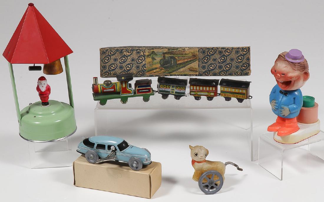 GOOD MIX OF 5 VINTAGE TOYS C 1900-1950: GOOD MIX OF 5 VINTAGE TOYS C. 1900-1950. Comprising a good earlier Japanese tin litho train in original box (length 8 inches), a Japanese tin key wind race car in original box, a celluloid roly s