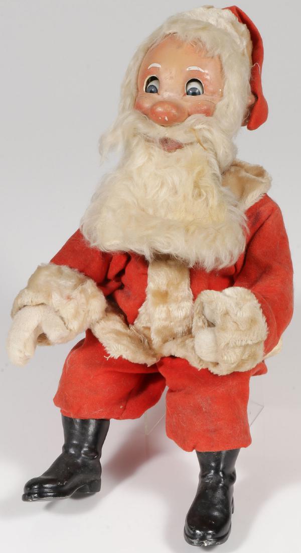 GREAT KEY WIND AUTOMATON SANTA, C 1920'S: GREAT KEY WIND AUTOMATON SANTA, C. 1920'S. Comprising a large jolly Santa with papier-mache and composition boots and a well-crafted papier-mache head set with glass doll eyes. Interio