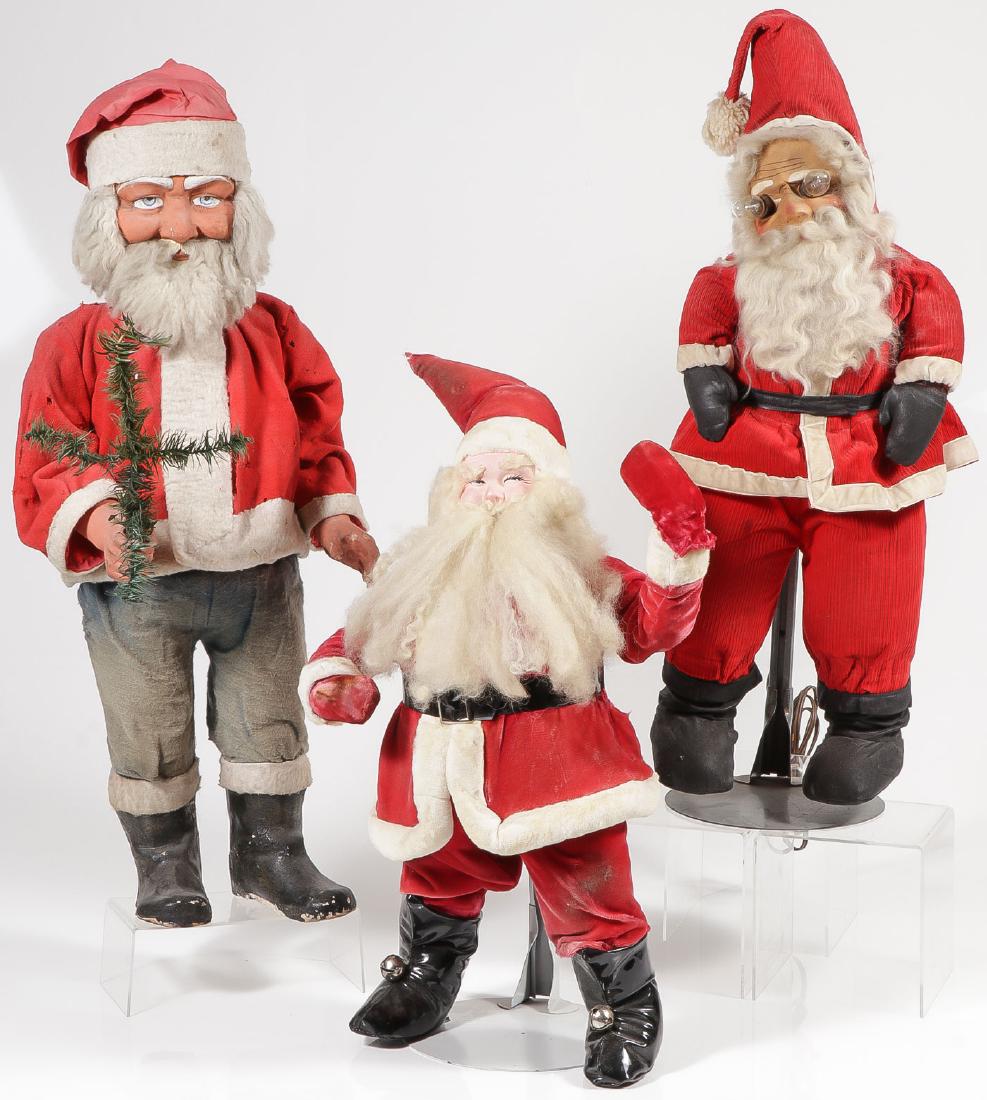 3 LARGE VINTAGE DISPLAY SANTA DOLLS: 3 LARGE VINTAGE DISPLAY SANTA DOLLS. Two with composition faces, one with cloth painted face. Greatest height 29 inches. Provenance: From the lifetime collection of Patricia Miller (1949-2017).