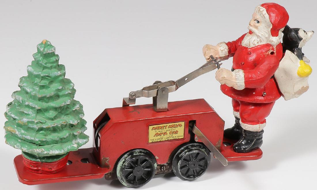 A LIONEL MICKEY MOUSE SANTA CAR: A LIONEL MICKEY MOUSE SANTA CAR. Good original working order, Santa on a hand car with bag over his shoulder which holds Mickey Mouse and on the front a Christmas tree, length 11 inches. Provenance: