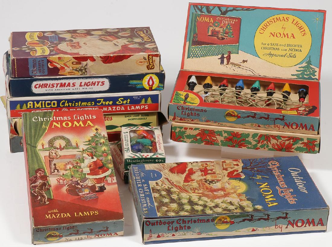 A GROUP OF VINTAGE CHRISTMAS TREE LIGHTS: A GROUP OF VINTAGE CHRISTMAS TREE LIGHTS. In their original box. Including various makers, all with good color lithograph box covers. Greatest measurement 12.5 inches. Provenance: From the lifetime