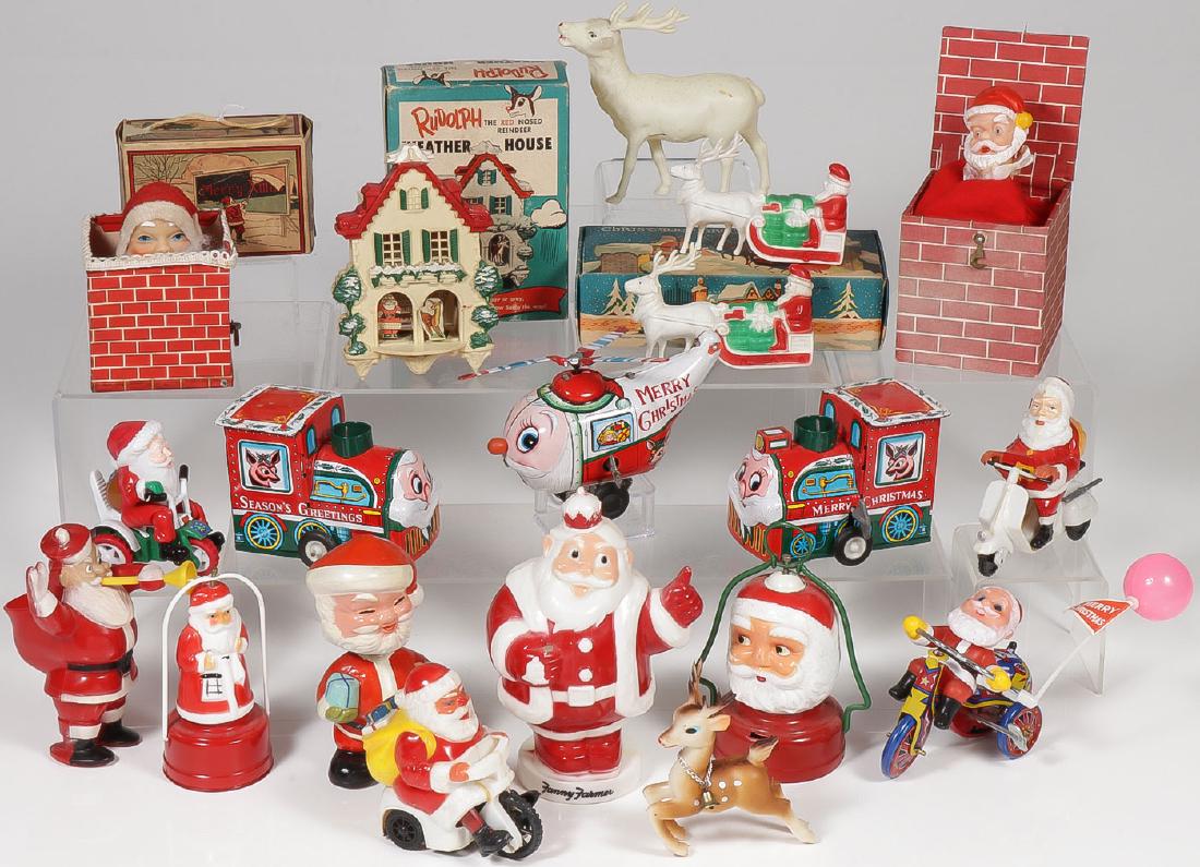 20 CHRISTMAS SANTA DECORATIONS: 20 CHRISTMAS SANTA DECORATIONS. Comprising plastic and tin wind-ups, a bobble head, battery-operated lanterns, Santas on scooters, pop-up Santas out of chimneys, a Rudolph Weather House in
