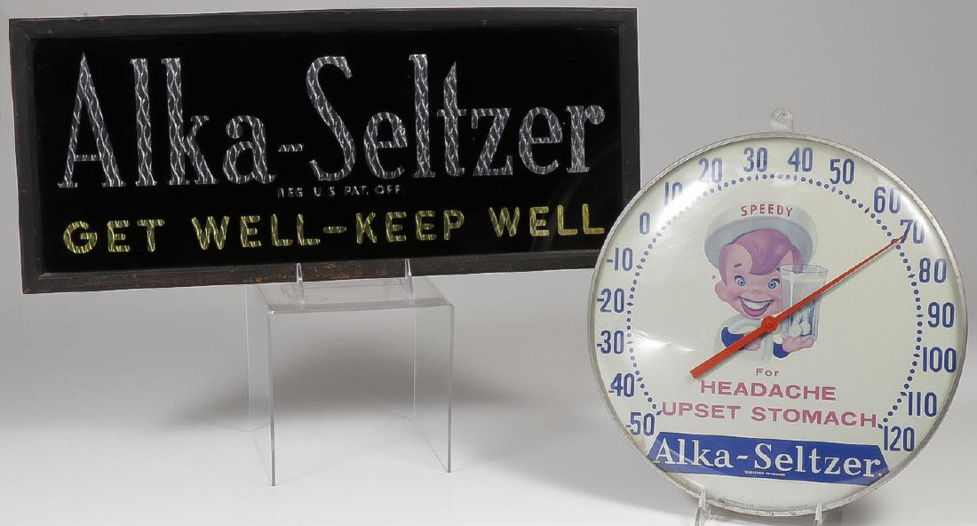 AN ALKA-SELTZER ADVERTISING SIGN AND THERMOMETER: AN ALKA-SELTZER ADVERTISING SIGN AND THERMOMETER. Comprising an Alka-Seltzer "Get Well Keep Well" drug store sign, reverse paint on glass with silver & gold foil backing, height 9 inc