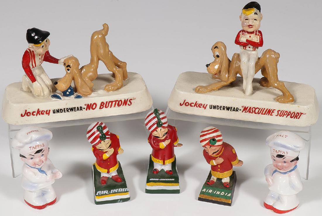 VINTAGE ADVERTISING MASCOTS: VINTAGE ADVERTISING MASCOTS. Comprising a pair of Jockey Brand composition statues, three Air India figures, in various materials (plaster, plastic, and composition), and a pair of Tappan Brand salt