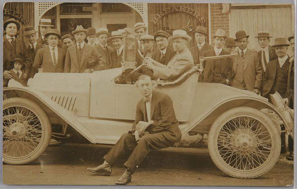 A REAL PHOTO POSTCARD Jim Jeffries and Jack Johns: A REAL PHOTO POSTCARD Jim Jeffries and Jack Johnson and auto in front of The Breakers Cafe San Francisco. Nice clear image; slight edge in corner ware no creases. Excellent condition. Estimate $200-40