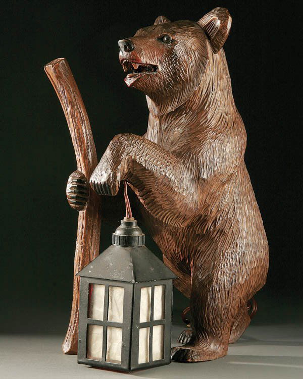 A VERY FINE SWISS CARVED "BLACK FOREST" BEAR WITH: A VERY FINE SWISS CARVED "BLACK FOREST" BEAR WITH LANTERN, 20th century, hand carved walnut standing figure of a bear with walking stick and lantern. Height 13.5 inches. Estimate $800-$1,200