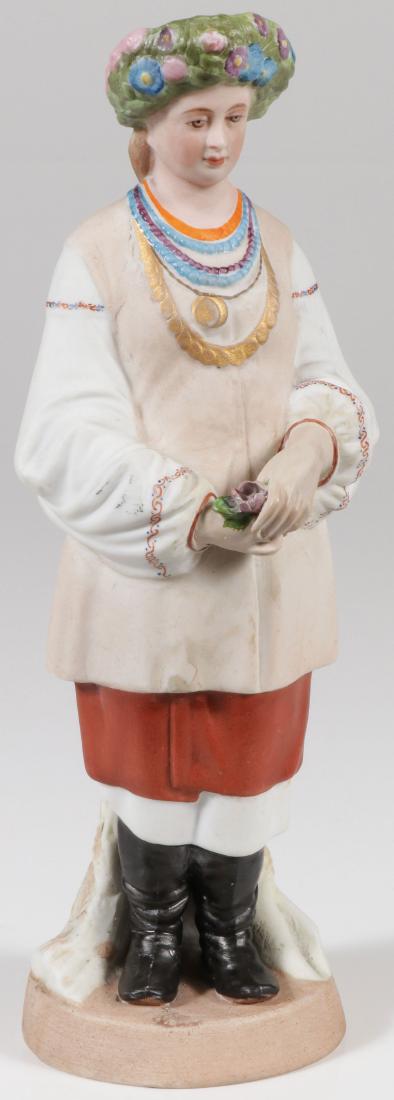 A RUSSIAN PORCELAIN FIGURE, GARDNER, 19TH C: A RUSSIAN BISQUE PORCELAIN FIGURE, GARDNER, 19TH CENTURY. Finely modelled as a standing young Ukrainian woman with flower wreath in her hair, a shock of wheat behind her, necklaces, embroidered shirt,