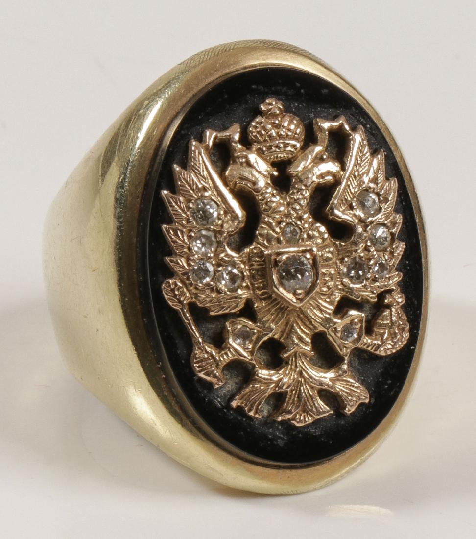 14K DIAMOND IMPERIAL RUSSIAN STYLE SIGNET RING: A MAN'S 14K AND DIAMOND IMPERIAL RUSSIAN STYLE SIGNET RING. Comprising a large heavy 14K gold men's setting mounted with an oval polished black onyx medallion set with a chased gold Russian Imperial