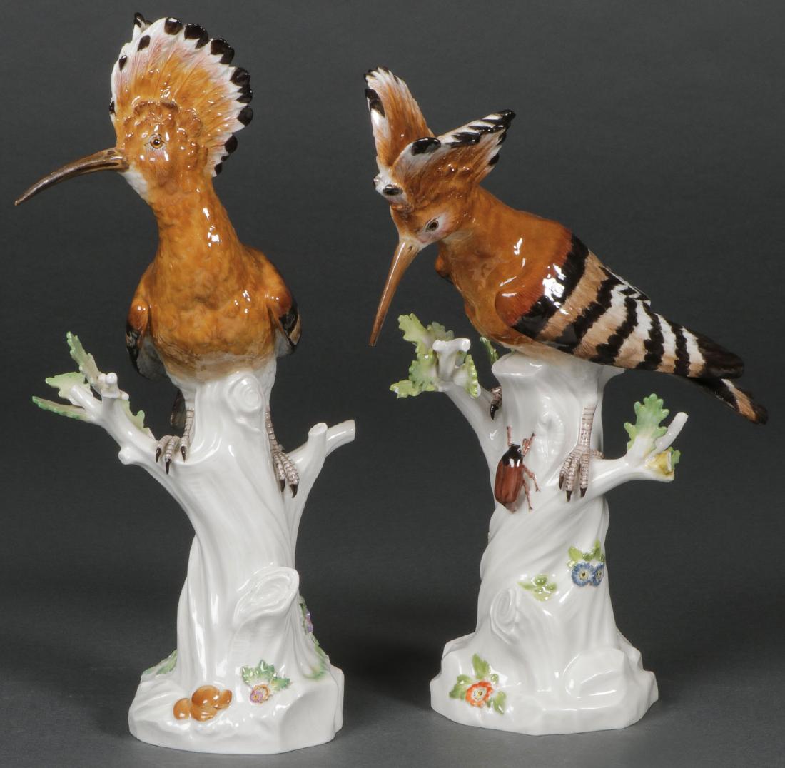 A PAIR OF MEISSEN PORCELAIN HOOPOE BIRDS, C 1900: A PAIR OF MEISSEN PORCELAIN HOOPOE BIRDS, CIRCA 1900. Comprising a pair of colorfully rendered Hoopoe birds on tree trunk form bases decorated with flower sprigs and one with beetle after the original