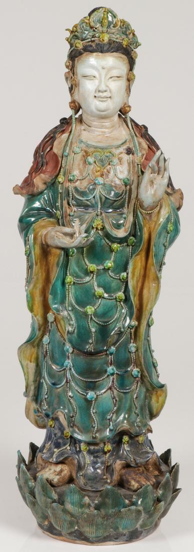 A LARGE AND IMPRESSIVE CHINESE SANCAI QUANYIN: A LARGE AND IMPRESSIVE CHINESE SANCAI QUANYIN. Finely sculpted in full round, of good anatomy and proportions, and with excellent detailing throughout. A few minor losses on lotus petal base. Height 2
