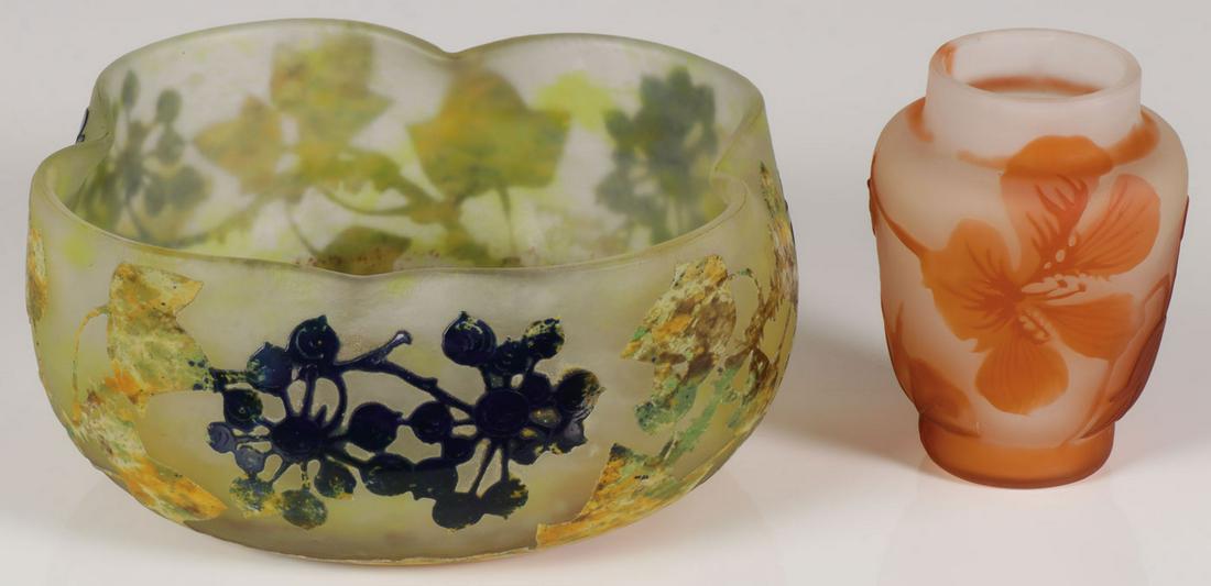 TWO FRENCH CAMEO GLASS PIECES: TWO FRENCH CAMEO GLASS PIECES. Comprising a Daum bowl with scalloped rim in multi-colored mottled glass etched and cut back to reveal berry vines with raised signature Daum Nancy, and the cross of Lo