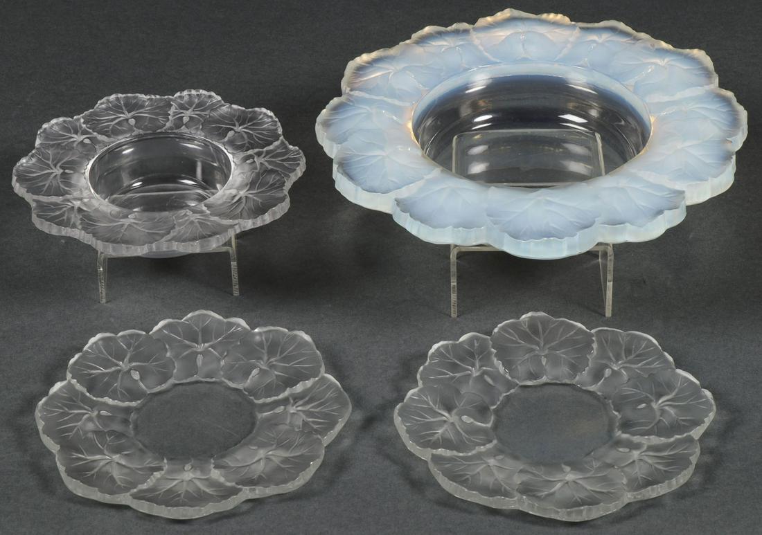 FOUR LALIQUE HONFLEURS GERANIUM PIECES: FOUR LALIQUE HONFLEURS GERANIUM PIECES. Comprising a bowl with opaque leaf border, signed LALIQUE FRANCE, diameter 8.6 inches (22 cm), a smaller bowl with frosted leaf border, also signed LALIQUE FRA