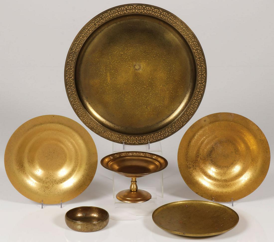 SIX TIFFANY DORE BRONZE PIECES: SIX TIFFANY DORE BRONZE PIECES. Comprising a large Tiffany Studios marked Dore bronze charger with decorative border, shape number 1747, diameter 14 inches. Together with a pair of matching Dore bronz