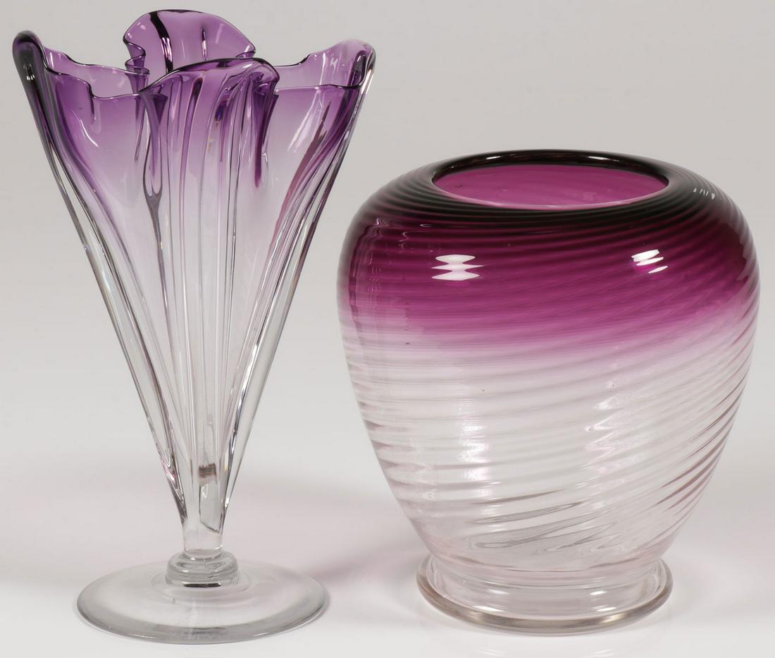 PAIR OF STEUBEN VASES: PAIR OF STEUBEN VASES. Comprising a handkerchief vase and a swirl decorated vase, both in clear to amethyst, the handkerchief vase with visible signature, the other without. Greatest height 9 inches.