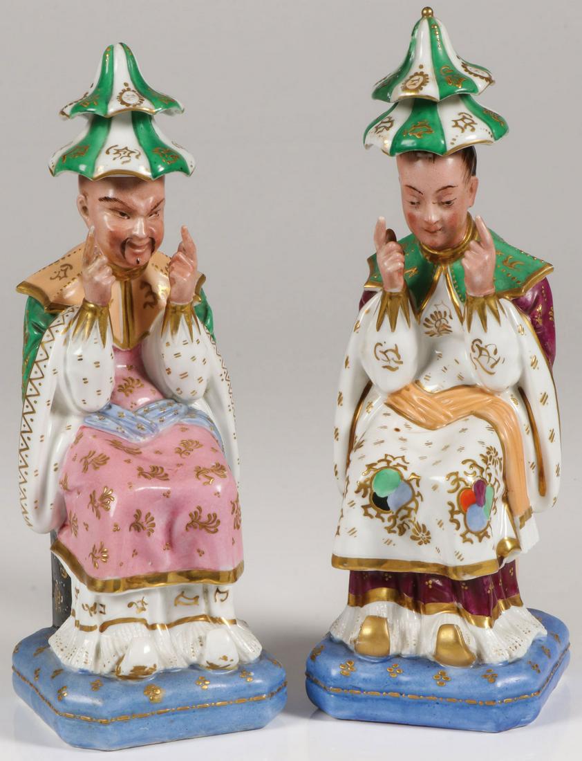 RARE FRENCH JACOB PETIT PORCELAIN FIGURAL BOTTLES: RARE FRENCH JACOB PETIT PORCELAIN FIGURAL BOTTLES. Comprising a seated Mandarin husband and wife resting atop blue silk pillow forms with removable hat stoppers and extensive gilt decoration. Undersi