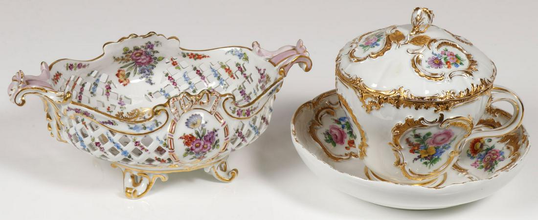 MEISSEN PORCELAIN GROUPING, 19TH CENTURY: MEISSEN PORCELAIN GROUPING, 19TH CENTURY. Comprising a pierced footed basket with floral and gilt decoration, width 11 inches (28 cm), and a large covered cup and saucer in the Rococo style with gilt 