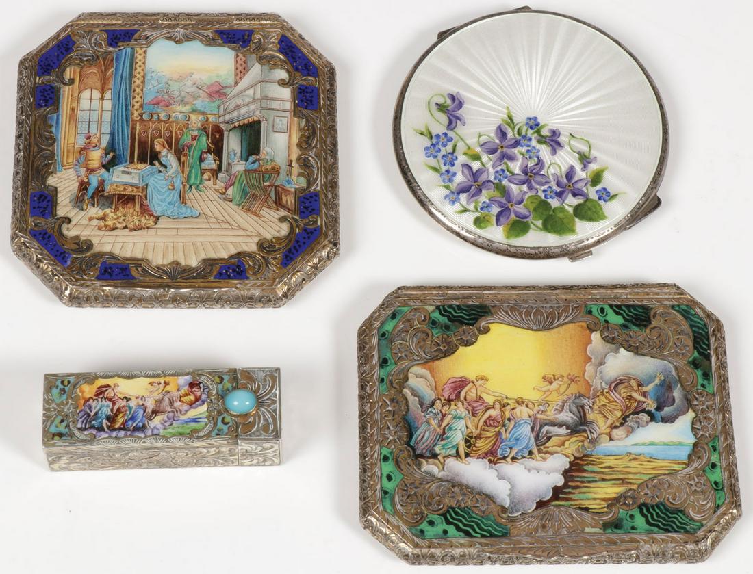 EUROPEAN SILVER AND ENAMEL COMPACTS: EUROPEAN SILVER AND ENAMEL COMPACTS. Comprising two large and ornate compacts, each with hinged lid displaying an enamel painted scene, one depicting Apollo riding in a chariot with galloping stallion