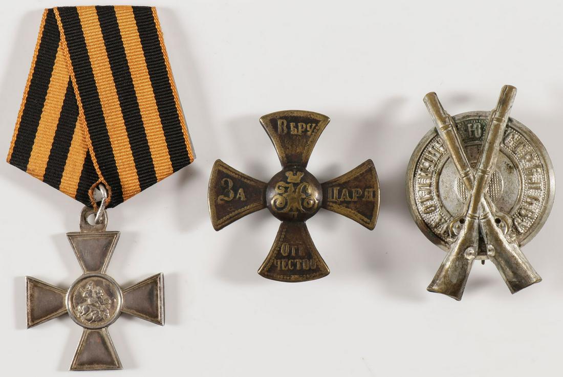 THREE IMPERIAL RUSSIAN WWI BADGES: THREE IMPERIAL RUSSIAN WWI BADGES. Comprising a IV Class St. George cross in silver, issuance number No. 20135 on later ribbon, 34 x 34 mm, a badge for the state Militia during the reign of Nicholas I