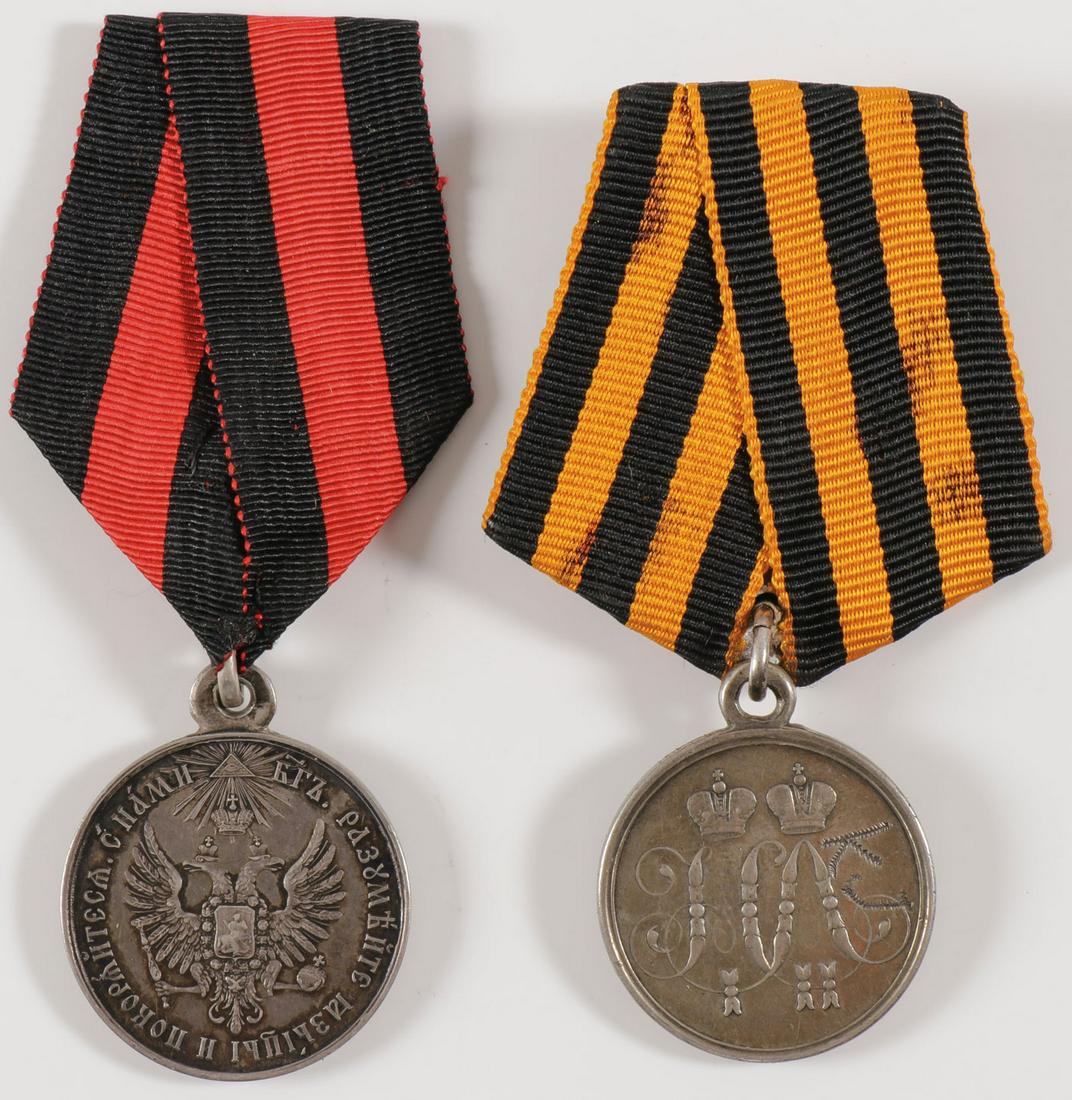 A PAIR OF IMPERIAL RUSSIAN SILVER MEDALS C. 1850: A PAIR OF IMPERIAL RUSSIAN SILVER MEDALS C. 1850. Comprising a silver Defense of Sevastopol medal, 1855. The obverse with intertwined ciphers of Tsar Nicholas I and Alexander II, verso with all-seeing