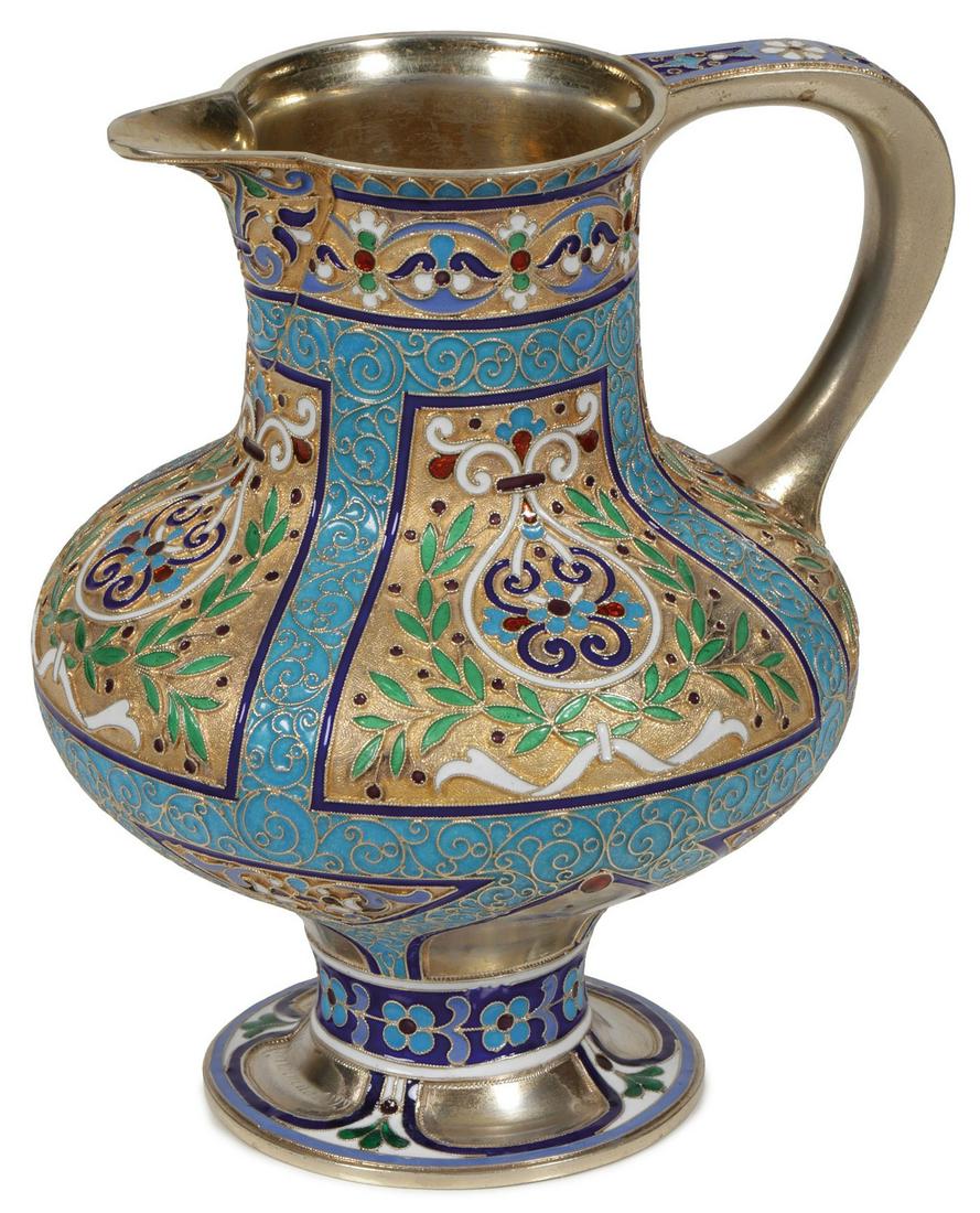 A RUSSIAN SILVER-GILT AND ENAMELED CREAMER: A RUSSIAN SILVER-GILT AND ENAMELED CREAMER. With spread foot, of baluster form, the sides in cloisonné enamel in scrolling foliage and the interior brightly gilded. Hallmarked Moscow, 88 silver stan