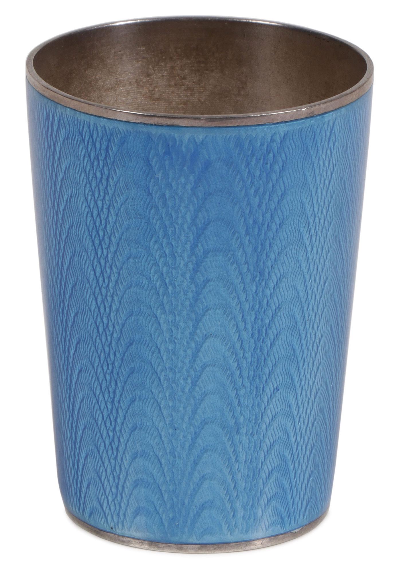 RUSSIAN SILVER ENAMEL BEAKER SHOT GLASS: RUSSIAN SILVER ENAMEL BEAKER SHOT GLASS. A Russian silver gilt and guilloche enamel beaker, Grachev Brothers, St. Petersburg, 1899-1903. Of tapering form enameled translucent cerulean blue over a wav