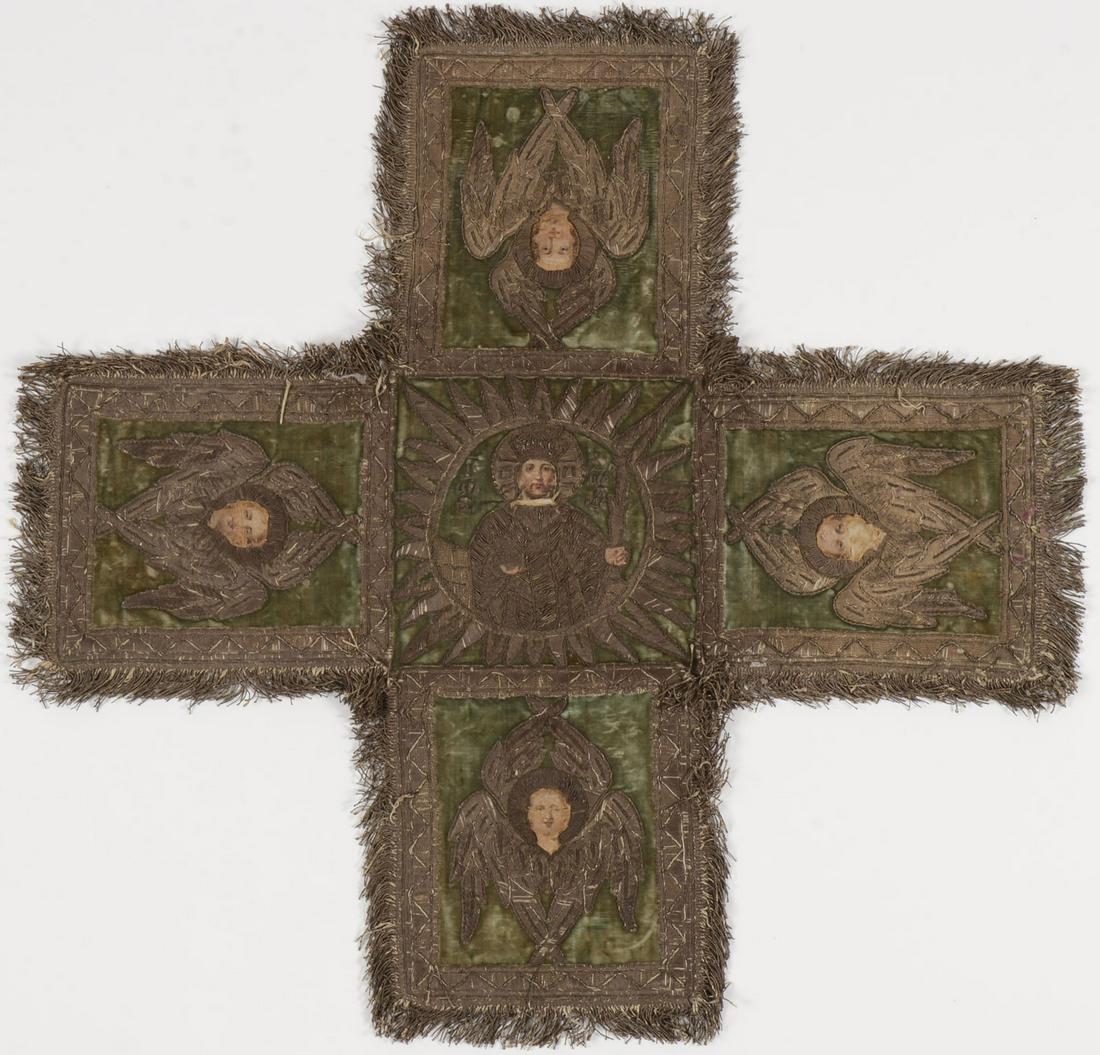 A RUSSIAN EMBROIDERED CHALICE COVER, 19TH C: A RUSSIAN EMBROIDERED CHALICE COVER, 19TH C. The green velvet cross-form with silver embroidered borders and fringe, depicting at center within a medallion Christ as The King of Kings and each cross e