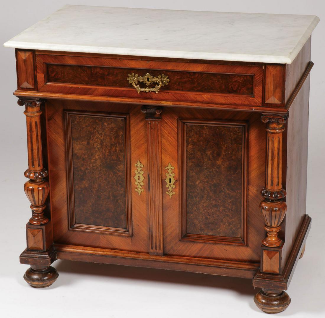 A VICTORIAN MARBLE TOP SERVER: A VICTORIAN MARBLE TOP SERVER. Comprising a buffet with marble top above a single drawer and two door cabinet flanked by column form spindles on either side resting on four bun feet. 35 inches x 33 in