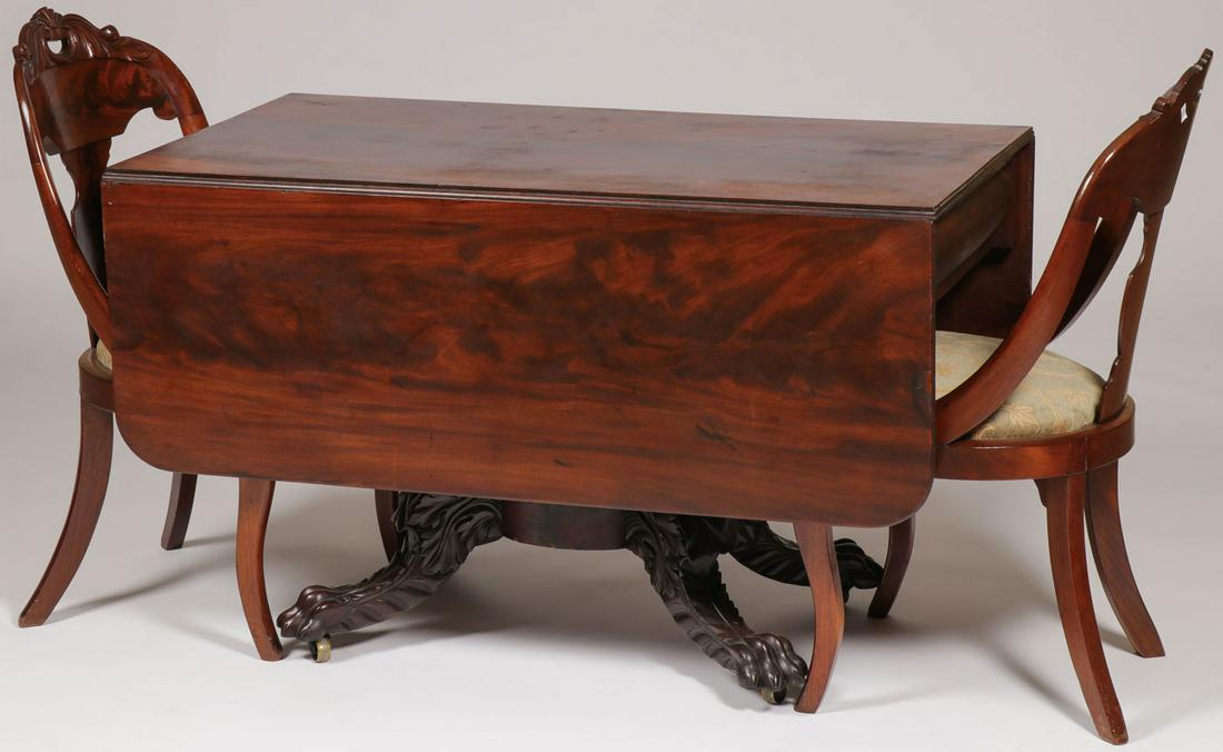 A FINE EMPIRE MAHOGANY DROP LEAF TABLE & CHAIRS: A FINE EMPIRE MAHOGANY DROP LEAF TABLE & CHAIRS. Comprising a fine Empire drop leaf table with rectangular shaped top above two drawers and a pedestal base giving way to four finely carved paw feet.