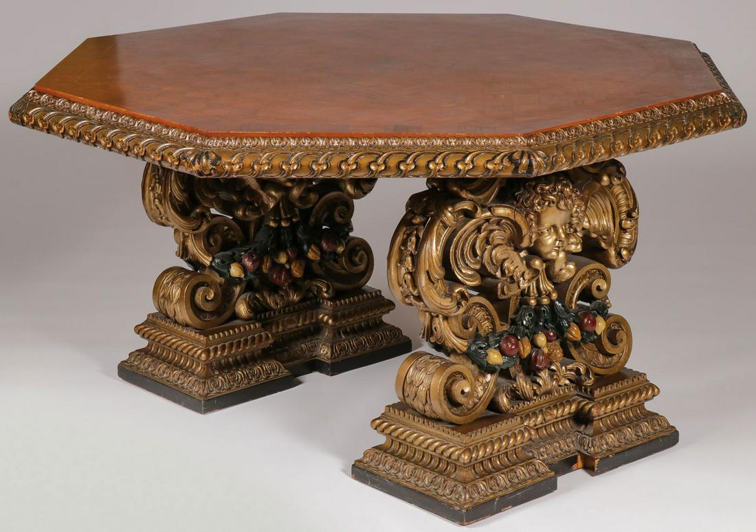 AN INTERESTING CARVED PARLOR TABLE, CIRCA 1920: AN INTERESTING CARVED PARLOR TABLE, CIRCA 1920. Comprising an interesting and finely crafted table in the Renaissance Revival taste with inlaid octagon top resting atop two similarly and heavily carve