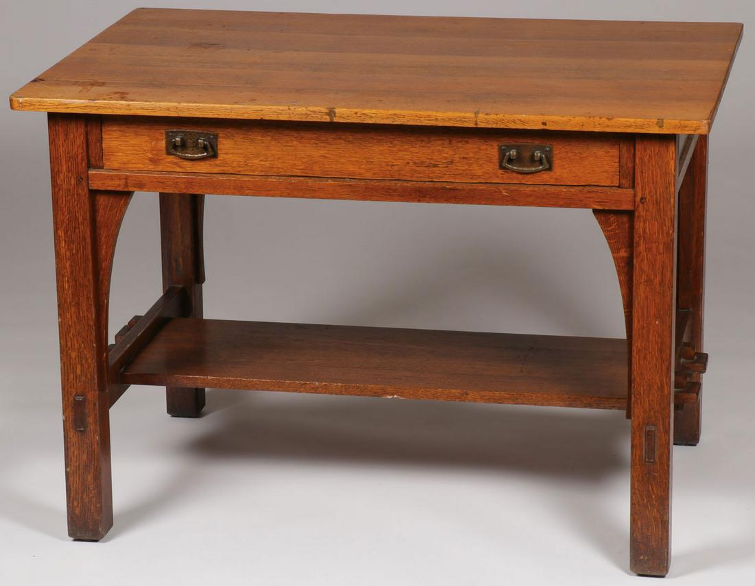 L & JG STICKLEY LIBRARY TABLE #529: L & JG STICKLEY LIBRARY TABLE #529. Comprising a rectangular top above two drawers with original copper hardware and lower shelf supported by double key and tenon construction. Maker's decal inside dr