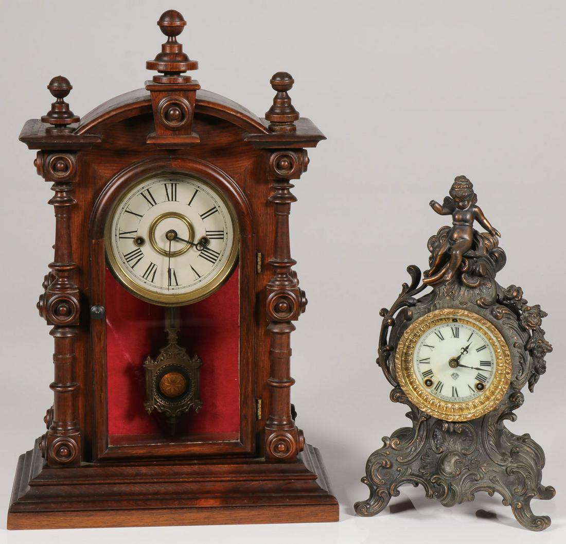 A PAIR OF VINTAGE MANTEL CLOCKS: A PAIR OF VINTAGE MANTEL CLOCKS. Comprising an Ansonia brass shelf clock in the Rococo style with cherub at top above a glazed front opening to reveal a porcelain face with roman numerals. Height 13 i