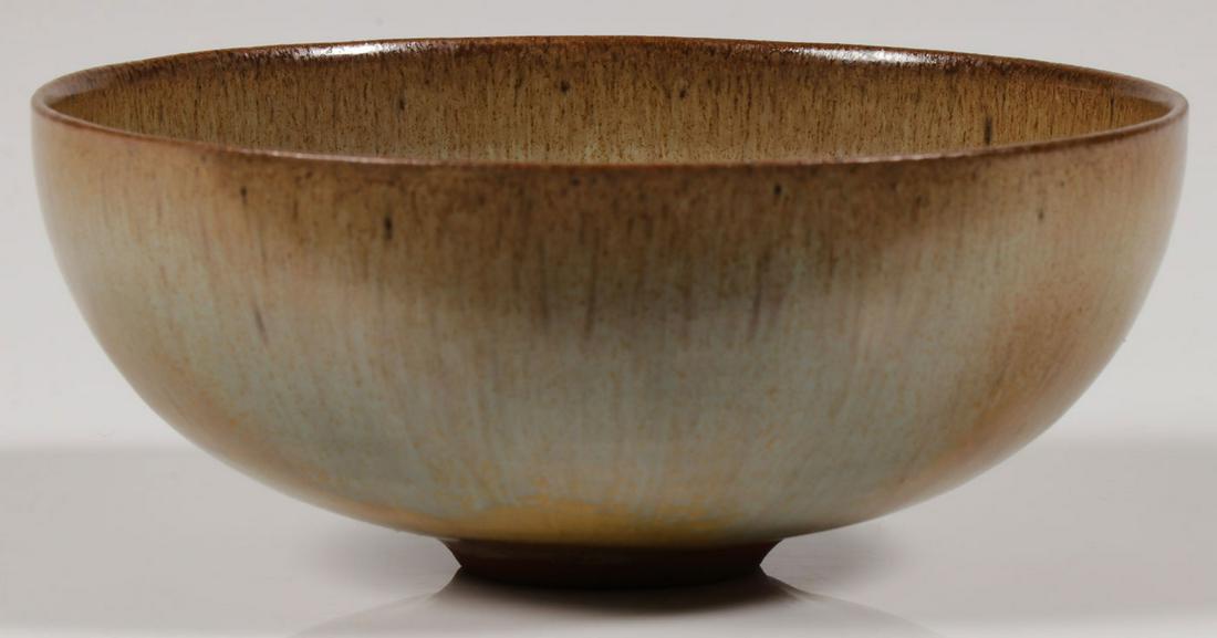AN OTTO & GERTRUD NATZLER BOWL: AN OTTO & GERTRUD NATZLER BOWL. The finely crafted bowl with ultra-thin walls and earth tone glazes resting on a raw ring foot, signed NATZLER on underside of base. Height 1.8 inches , diameter 4.3 in