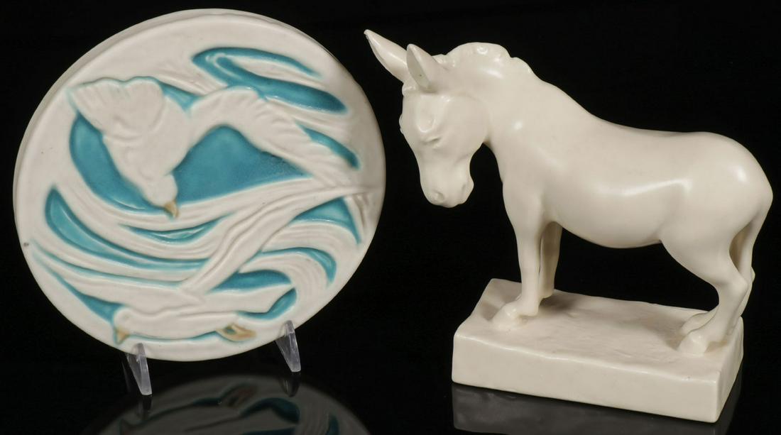 ROOKWOOD POTTERY CIRCA 1925-1932: ROOKWOOD POTTERY CIRCA 1925-1932. Comprising a Rookwood Seagull Trivet, with impressed Rookwood mark and date of 1925, diameter 6 inches, and a Rookwood Mule book end, with impressed Rookwood mark and