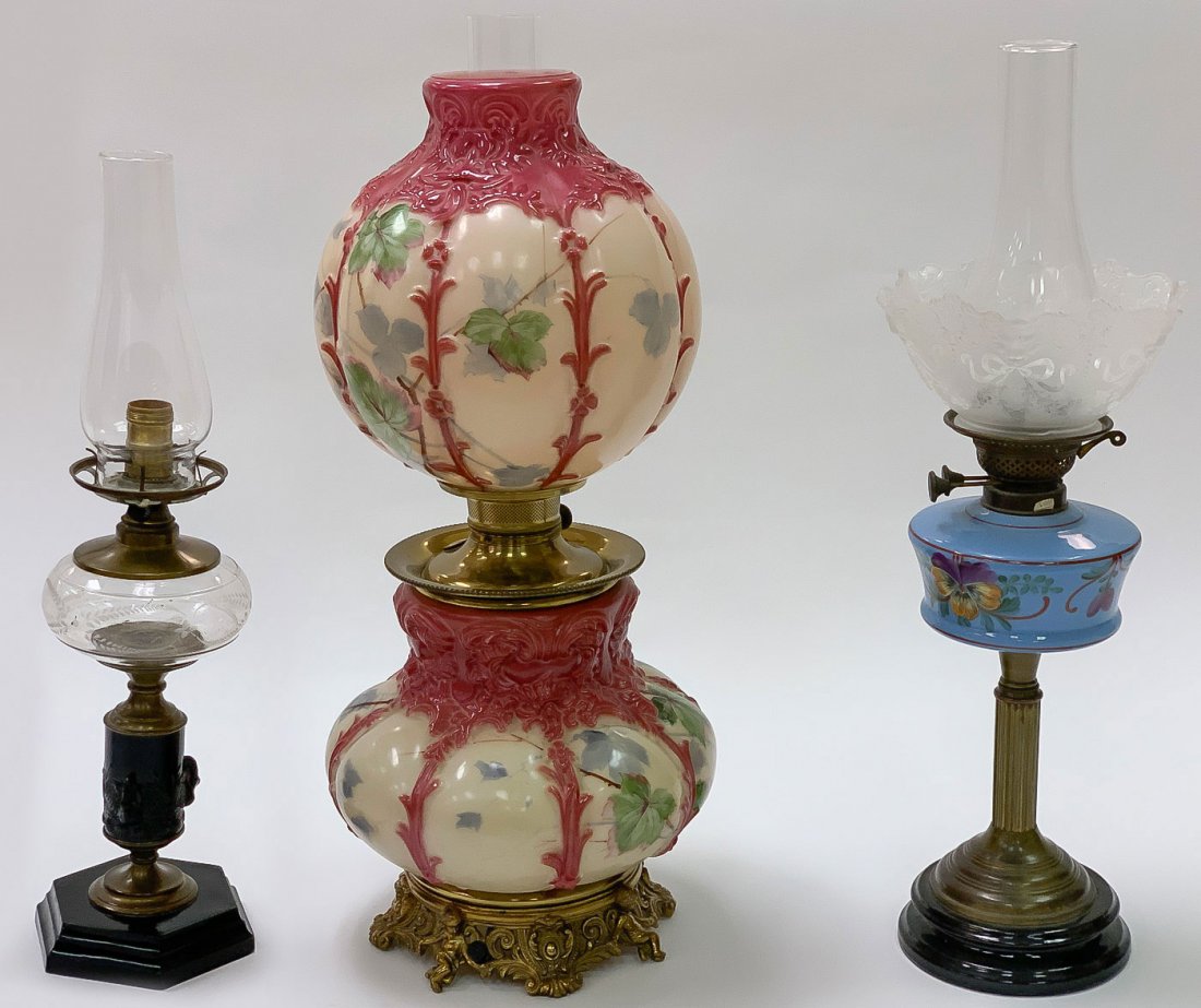 THREE VINTAGE LAMPS: THREE VINTAGE LAMPS. Comprising a large and impressive hand-painted Gone With the Wind lamp with matching glass molded and hand-painted base and melon ribbed shade, original oil reservoir, and ornate 